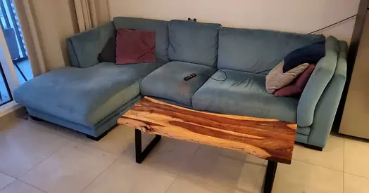 Comfortable Blue Sofa with Unique Wooden Coffee Table