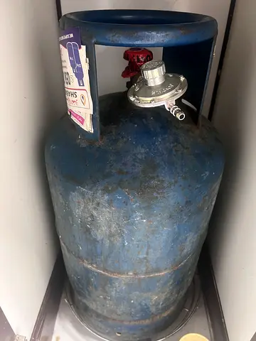 Half filled small size Gas Cylinder with new purchased Regulator  hose for Sale