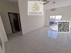 For rent in Ajman, first occupancy, one bedroom and living room with 2 bathrooms and balcony in Al N