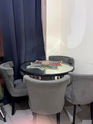 Elegant Round Dining Table with Unique Tablecloth