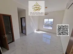 For rent in Ajman, first occupancy, two bedrooms, a living room with 2 bathrooms and a balcony in Al