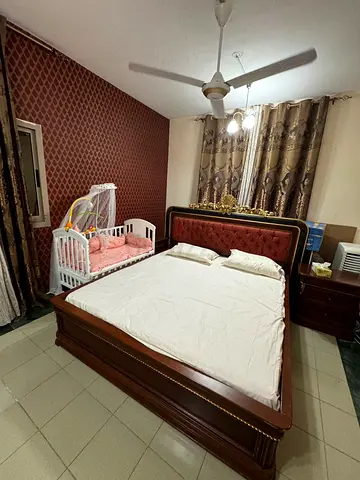 Comfortable Nursery Setup with Crib and Bed