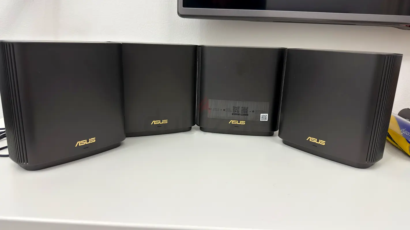 Four ASUS AX6600 Tri-Band Mesh WiFi Routers