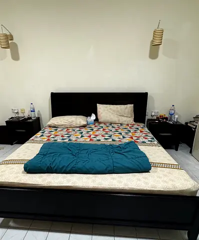 Cozy king size bed with side tables dresser and stool with free mattress