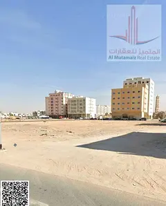 For sale in Ajman, land in Al Rawda, the second plot from Sheikh Maktoum Street, area 9881, resident