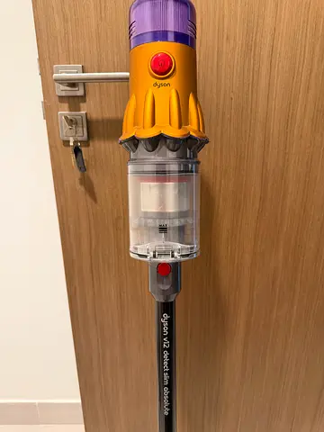 Dyson V12 vacuum with attachments