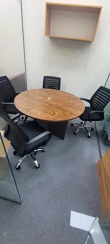 Round Office Meeting Table with Black Chairs