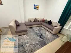 A one-bedroom apartment with a living room is available for monthly rent in Al Jurf 2, Al Yasmin Tow