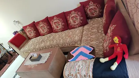 Comfortable L-Shaped Sofa with Cushions