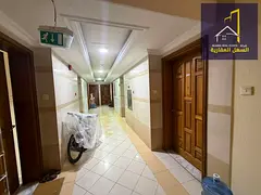 Building for sale in Al Majarra area, corner lot on two streets opposite the mosque, with an income