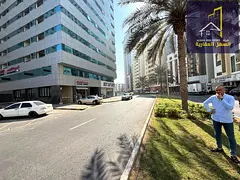 Land for sale in Al Majaz 2, featuring a prime location on a paved 36-meter-wide road. The plot is t