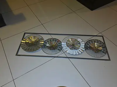 Elegant Wall Decor with Metallic Fans.