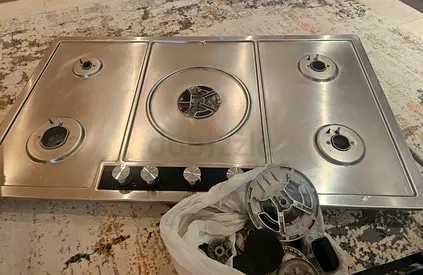 Stainless Steel 5-burner gas cooktop.  Dhs 1200