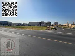 Corner plot of land on a main street for sale in Al-Jarf Industrial Area 2. The land area is 10,000