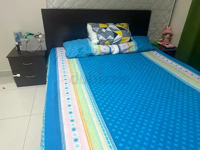 Comfortable brown Bed with Stylish Bedside Table and storage