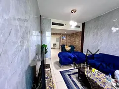 Two bedrooms and a living room for sale, cash payment, in Ajman Towers, with a closed kitchen