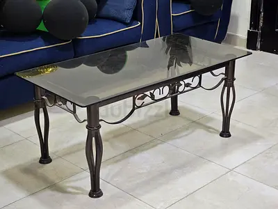 Elegant Glass Top Coffee Table with Decorative Legs