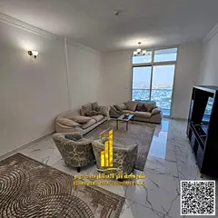 With an open view, a furnished 2-bedroom apartment with a living room for monthly rent in Ajman - Ra