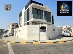 For sale in Al Zahia, Ajman: a villa with four master bedrooms, a living room, a majlis, and a maid&