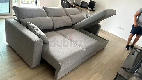 Light _grey eskilstuna L shape sofa bed under storage space
