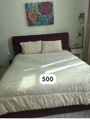 Elegant King Size Bed with Stylish Headboard