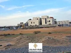 Land for sale 280 sqm opposite Azha Compound with G+2 building permit, prime location, ideal for inv