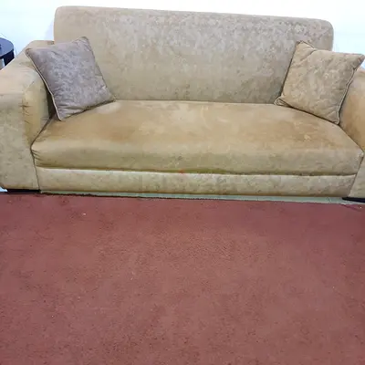 Comfortable Beige Sofa with 6 Cushions and 2 carpets