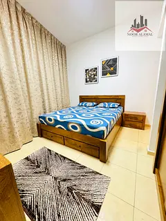 Sharjah, Al Khan: One bedroom apartment with living room, kitchen, two bathrooms, and balcony overlo