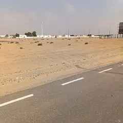 Two residential plots for sale in Sharjah, Rawdat Al Qurt area.