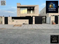 Luxury villa with a modern design, 5000 sq ft, with a garden, behind Ajman Academy. Price includes a