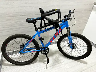 Well-Maintained Mountain Bike for Sale Size 26 with detachable baby seat and helmet