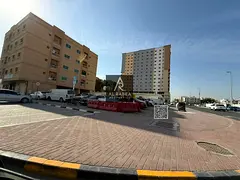 **English Translation:** A prime plot of land for sale in **Al Nuaimiya 1**, strategically located *