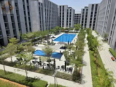 A stylish, modern one-bedroom apartment with a spacious living room and two bathrooms, located in a