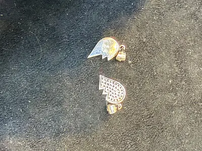 A Beautiful Set of Heart-Shaped Pendants for his n her