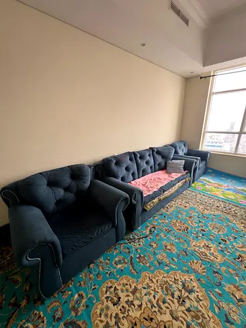 Elegant Blue Sofa Set with Vintage Touch