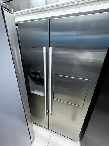 Siemens latest model iq700 side by side refrigerator with water depanser and ice cream mini bar