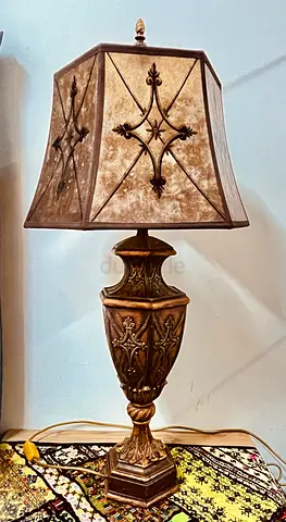 Two identical hand crafted wooden lamps from fine art store