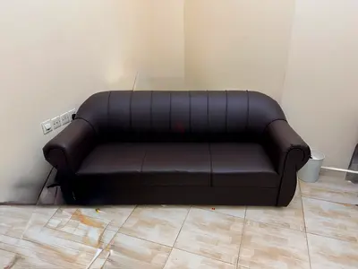 Brown coloured Rexine sofa