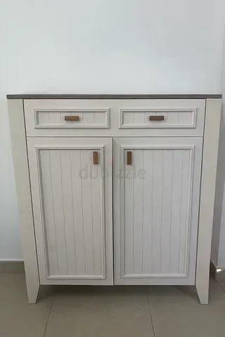 Elegant White Cabinet with Stylish Top