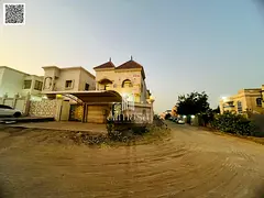 Own a luxury corner villa for sale — corner of two streets, classic stone facade, Al Muwaihat 1 