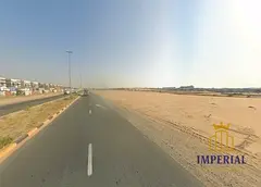 Commercial land available for sale in Helio 2, Ajman, located in a prime area suitable for various c