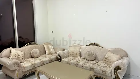 Elegant Beige Sofa Set with Intricate Design