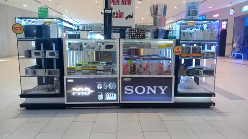 A fully operational mobile accessories and repair kiosk located inside RAK Mall , available for sale