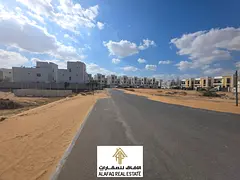 Corner land for sale in Al Zahia Ajman 3014 sq ft G+2 permit on Al Heliow main road prime location p