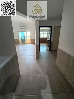 Two bedrooms, a living room, three bathrooms, built-in wardrobes, and a balcony in Al Rawda