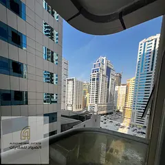Two-bedroom apartment with a living room in Al Khan area, Sharjah, featuring a sea view and a privat