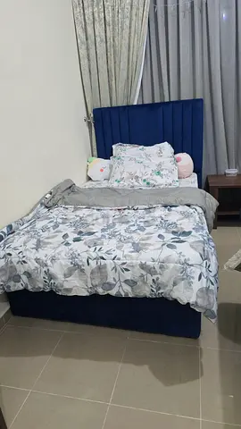 Cozy Blue Bed with Floral Bedding