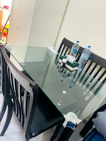Elegant Glass Dining Table with Black Chairs