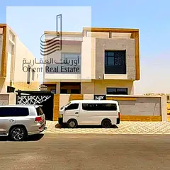 Villa for sale in Ajman, Al Yasmeen area, consisting of 5 master bedrooms, a large kitchen, a fitted