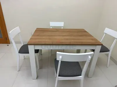 Stylish Dining Table with Four Chairs